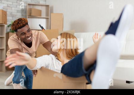 couple have fun feel euphoric moving together to new apartment Stock Photo