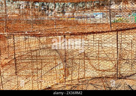 Fishing net made by metallic wire. Old rusty net for fishing Stock Photo