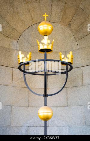 The emblem of Three Crowns representing Sweden national symbol, mounted at Tre Kronor Museum in Stockholm, denotes historical royalty and heritage. Sweden Stock Photo