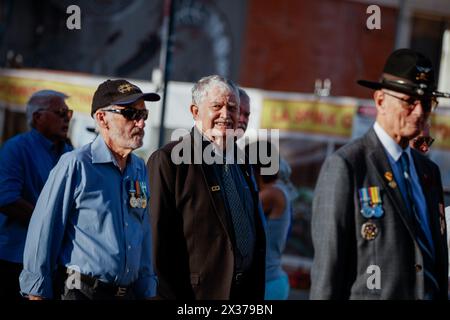 Vietnam War veterans take part in the ANZAC Day march along the Cairns Esplanade. Current and retired Australian Defence Force members and their families took part in the ANZAC Day dawn service at the Cairns Cenotaph and march along Cairns Esplanade organized by the Cairns RSL (Returned and Services League of Australia) on the 25th of April 2024.Though ANZAC Day was initially to commemorate those lost during the Gallipoli campaign during the First World War, it is now marked in remembrance of all service people killed in military actions. Stock Photo