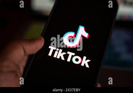 April 25, 2024: In this photo illustration, logo of Tiktok is displayed on mobile phone screen next to ban sign, in Guwahati, India 25 April 2024. US President Joe Biden signs law to ban Chinese-owned TikTok unless sold to US company. (Credit Image: © David Talukdar/ZUMA Press Wire) EDITORIAL USAGE ONLY! Not for Commercial USAGE! Stock Photo