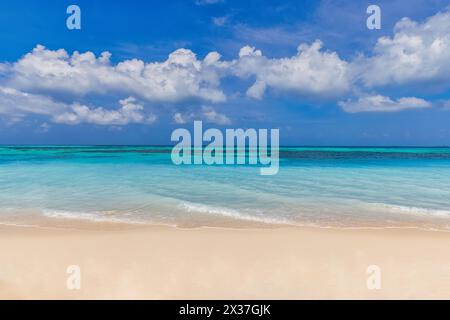Summer beach background. Sand and sea and sky. Sea view from tropical beach with sunny sky. White sandy tropical beach and soft sunlight wallpaper Stock Photo