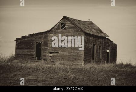 Old wooden abandoned house on the prairies in Western Canada Stock Photo