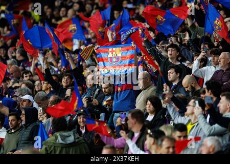 Barcelona, Spain. 16th Apr, 2024. Barca fans wave their flags during the Uefa Champions League match between FC Barcelona and Paris Saint-Germain at t Stock Photo