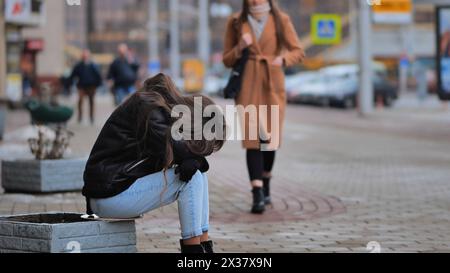 a-girl-crying-sitting-on-a-