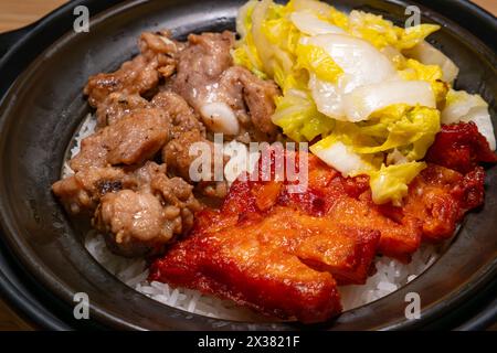 angle view Orleans-style Chicken Cutlet and Black Bean Spare Rib Claypot Rice at horizontal composition Stock Photo