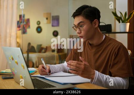 Portrait of high school student having video call with tutor Stock Photo