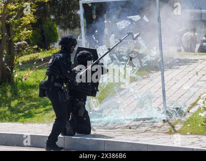 Seoul, South Korea. 25th Apr, 2024. South Korean Police Special Operation Unite members detonates a glass door during a terror response drill of 2024 Chungmu exercise in Seoul. South Korea's Chungmu exercise focuses on actual mobilization training for key resources and recovery training for damage to important facilities in order to master the verification and implementation procedures of wartime preparedness plans. Credit: SOPA Images Limited/Alamy Live News Stock Photo