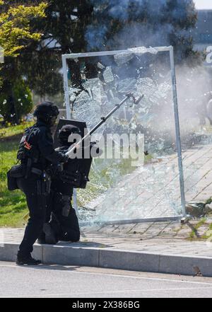 Seoul, South Korea. 25th Apr, 2024. South Korean Police Special Operation Unite members detonates a glass door during a terror response drill of 2024 Chungmu exercise in Seoul. South Korea's Chungmu exercise focuses on actual mobilization training for key resources and recovery training for damage to important facilities in order to master the verification and implementation procedures of wartime preparedness plans. Credit: SOPA Images Limited/Alamy Live News Stock Photo