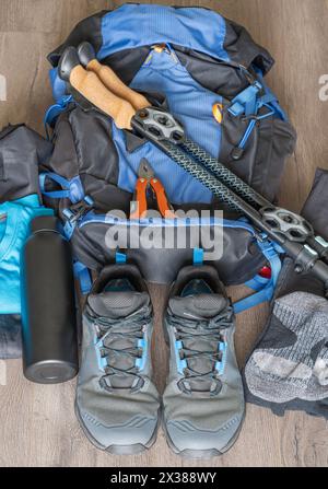Hiking equipment lined up on the wooden floor Stock Photo
