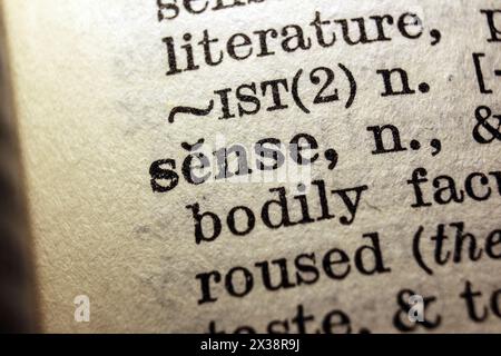 Word sense on dictionary page, macro close-up Stock Photo