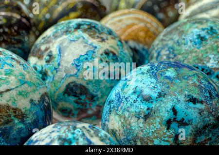 Group of multi-coloured balls made of various natural decorative stones, close-up shot, abstract background Stock Photo