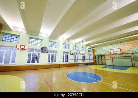 MOSCOW, RUSSIA - JUN 28, 2016: Gym with volleyball net, basketball hoops in 2107 school, In Moscow there are more than 1800 schools Stock Photo