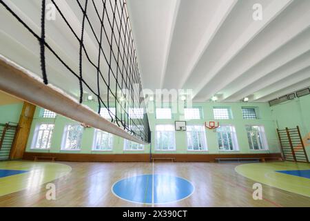 MOSCOW, RUSSIA - JUN 28, 2016: Empty gym with volleyball net in 2107 school, In Moscow there are more than 1800 schools Stock Photo