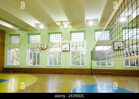 MOSCOW, RUSSIA - JUN 28, 2016: Gym with basketball hoops, volleyball net in 2107 school, In Moscow there are more than 1800 schools Stock Photo