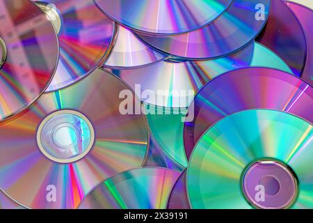 Pile of shiny compact discs pattern background Stock Photo