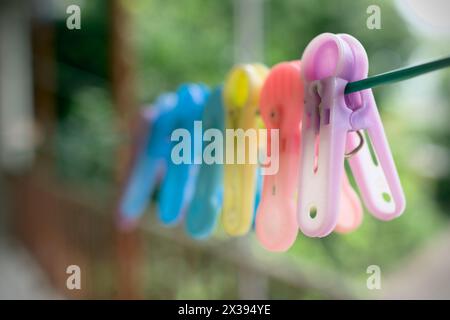 Old plastic cloth clip on the rope. Stock Photo