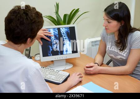 Medical informing patient  Column X-ray image, Physiotherapy medical center, Donostia, San Sebastian, Gipuzkoa, Basque Country, Spain Stock Photo