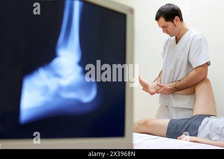 Mobilization passive inversion of the ankle, ankle X-ray image  Physiotherapy medical center, Donostia, San Sebastian, Gipuzkoa, Basque Country, Spain Stock Photo