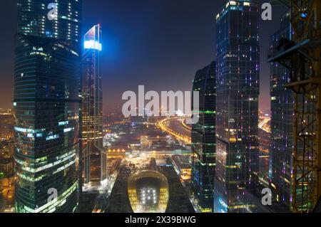 MOSCOW, RUSSIA - FEB 22, 2015: IQ Quarter in business complex Moscow City at night. Investments in project Central Core - 300 million dollars Stock Photo