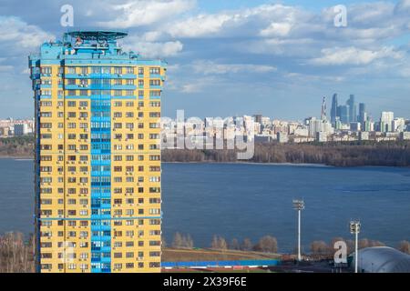 KRASNOGORSK, RUSSIA - APR 10, 2016: Tall residential building, river and Moscow city view, Krasnogorsk is city of regional subordination in Moscow Reg Stock Photo