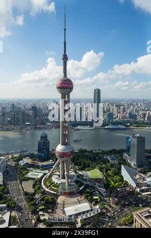 SHANGHAI - AUG 13, 2015: Oriental tower at sunny day, Oriental tower has height 468 m (1,535 feet), it was the tallest structure in China from 1994–20 Stock Photo