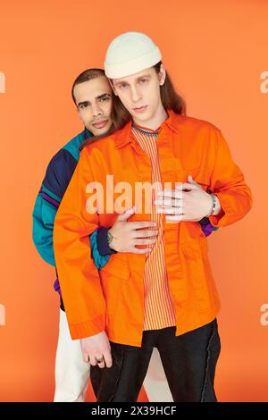 Two young men standing next to each other, exuding an aura of connection and love. Stock Photo