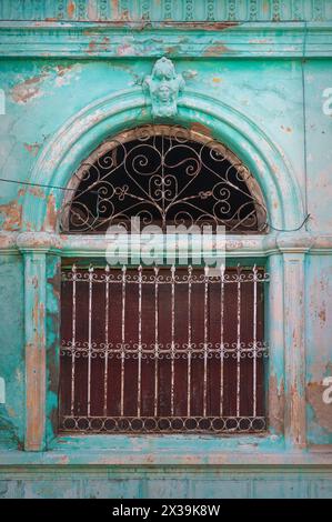 A typical old rundown property, which are often still lived in, that line the backstreets of Cienfuegos, Cuba Stock Photo