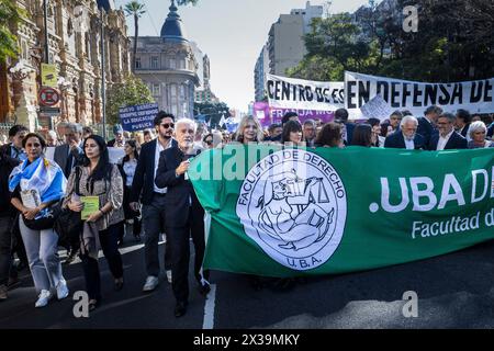 Buenos Aires, Argentina. 23rd Apr, 2024. Professors, teachers and students of the law school lead one of the columns heading to Plaza de Mayo during the rally. Protesters in favor of public and free education are protesting against budget cuts. The gathering began at various points in the city before converging in Plaza de Mayo around 5 pm. The protest was repeated in different parts of the country. Credit: SOPA Images Limited/Alamy Live News Stock Photo