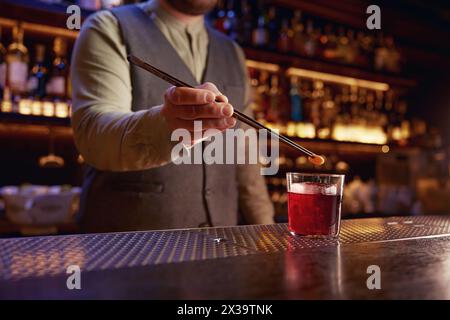Bartender working at bar counter closeup view on hands Stock Photo