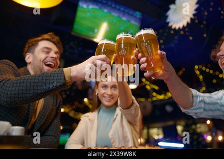 Friends drinking beer while rest in pub Stock Photo