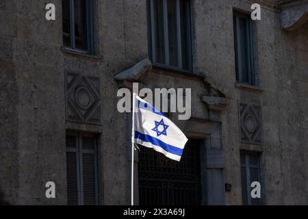Milano, Italy. 25th Apr, 2024. Israeli flag is displayed during the demonstration to mark the 81st anniversary of the Liberation Day, on April 25, 2024 in Milan, Italy. On April 25th, 1945, Italian partisans launched a massive uprising against the fascist regime and Nazi occupation, marking the date as Liberation Day, which honors the critical turning point when Italy began its liberation from fascist and Nazi control. (Photo by /Sipa USA) Credit: Sipa USA/Alamy Live News Stock Photo