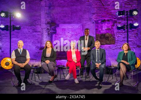 EDITORIAL USE ONLY Krishnan Guru-Murthy hosts the National Election debate, with guests, (seated left to right) Chris Farmer UK Parliamentary candidate for Gloucester Reform UK, Labour MP Alison McGovern interim shadow work and pensions secretary, Daisy Cooper MP - deputy leader Liberal Democrats, Conservatives MP Lee Rowley Minister for Housing, Planning and Building Safety and Ellie Chowns spokesperson for housing and communities Green Party, broadcast on Channel 4, from Blackfriars Priory in Gloucester, ahead of the local elections on Thursday May 2. Picture date: Thursday April 25, 2024. Stock Photo