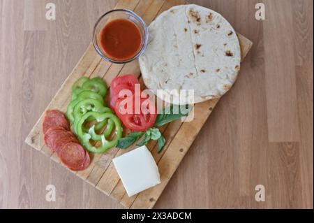 Homemade pizza ingredients, meal kits for dining at home or family fun night. Stock Photo
