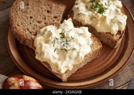 Slices of sourdough bread with spread made of leftover Easter eggs Stock Photo
