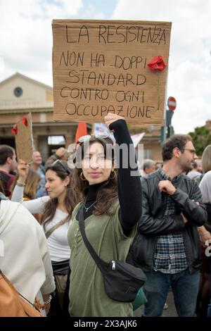 Rome, Italy. 25th Apr, 2024. A woman holds up a sign reading 'the resistance has no double standards, against every occupation' during the demonstration organized by the ANPI (National Association of Partisans of Italy) for the celebration of 25 April, the anniversary of the Liberation of Italy from Nazi-fascism, in Rome. (Credit Image: © Marcello Valeri/ZUMA Press Wire) EDITORIAL USAGE ONLY! Not for Commercial USAGE! Stock Photo