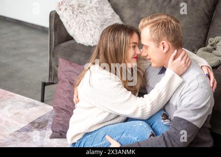 Enclosed in a comforting hug, a couple finds solace in each others presence, a scene capturing the essence of a supportive relationship on Valentines. Stock Photo