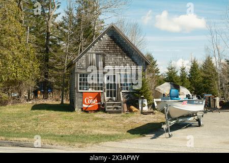 Old house and boat in Harrington, Maine Stock Photo