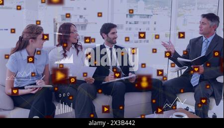 Image of connected icons, graphs over diverse male manager discussing with coworkers in office Stock Photo