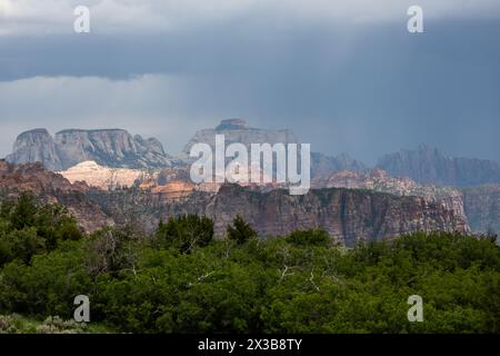 Sunlight Breaks Through Storm Clouds Over Zion National Park Stock Photo