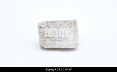 Cut out gypsum satin spar mineral rock isolated on white background. Gypsum is a soft sulfate mineral composed of calcium sulfate dihydrate, with the Stock Photo