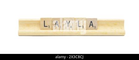 concept of popular newborn baby girl first name of LAYLA made with square wooden tile English alphabet letters with natural color and grain on a wood Stock Photo