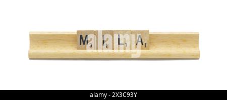 concept of popular newborn baby girl first name of MILA made with square wooden tile English alphabet letters with natural color and grain on a wood r Stock Photo