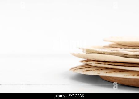 Stack of tasty lavash on white background, closeup Stock Photo