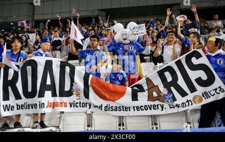 Doha, Qatar. 25th Apr, 2024. Fans of Japan cheer during the quarter-final match between Qatar and Japan at AFC U23 Asian Cup Qatar 2024 football tournament in Doha, Qatar, April 25, 2024. Credit: Nikku/Xinhua/Alamy Live News Stock Photo