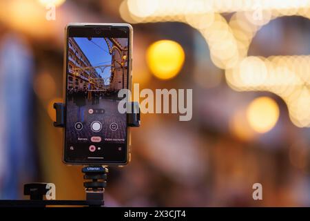 Alcoy, Spain, 04-19-2024: Media using mobile technology for their work. Pasodoble festival in Alcoy Stock Photo