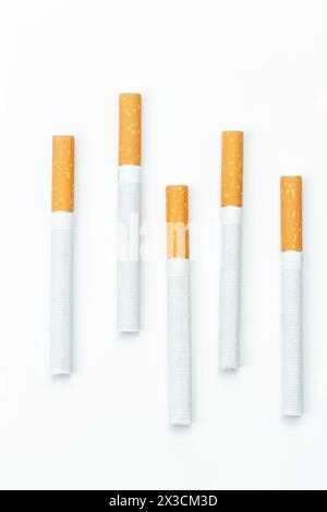 $5 cigarettes Five cigarettes on white background, place to write Stock Photo