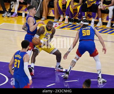 Los Angeles, Unite States. 25th Apr, 2024. Los Angeles Lakers forward LeBron James (23) loses control of the ball as he is triple-teamed during the first half in Game 3 of their Western Conference first-round playoff series at Crypto.com Arena in Los Angeles on Thursday, April 25, 2024. Photo by Jim Ruymen/UPI Credit: UPI/Alamy Live News Stock Photo