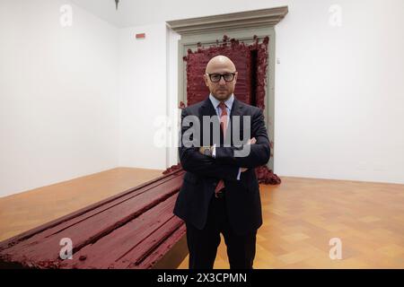 The General Director of the Palazzo Strozzi Foundation, Arturo Galansino is the curator of the exhibition “Anish Kapoor - Untrue Unreal” at Palazzo Strozzi in Florence. Galansino is also a well-known Italian art historian and art critic. In the background, Kapoor's monumental installation ‘Svayambhu' (2007 - wax, oil-based paint).  ©Isabella De Maddalena/opale.photo Stock Photo