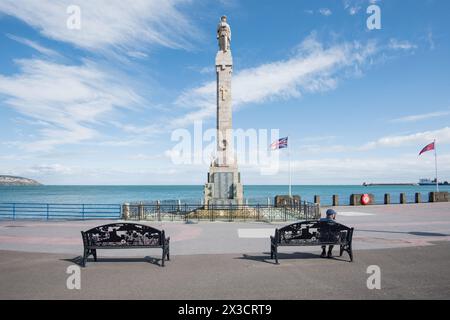 World War Monument on Douglas seafront, Isle of Man, with a statue of a soldier on top of a tall column, Stock Photo
